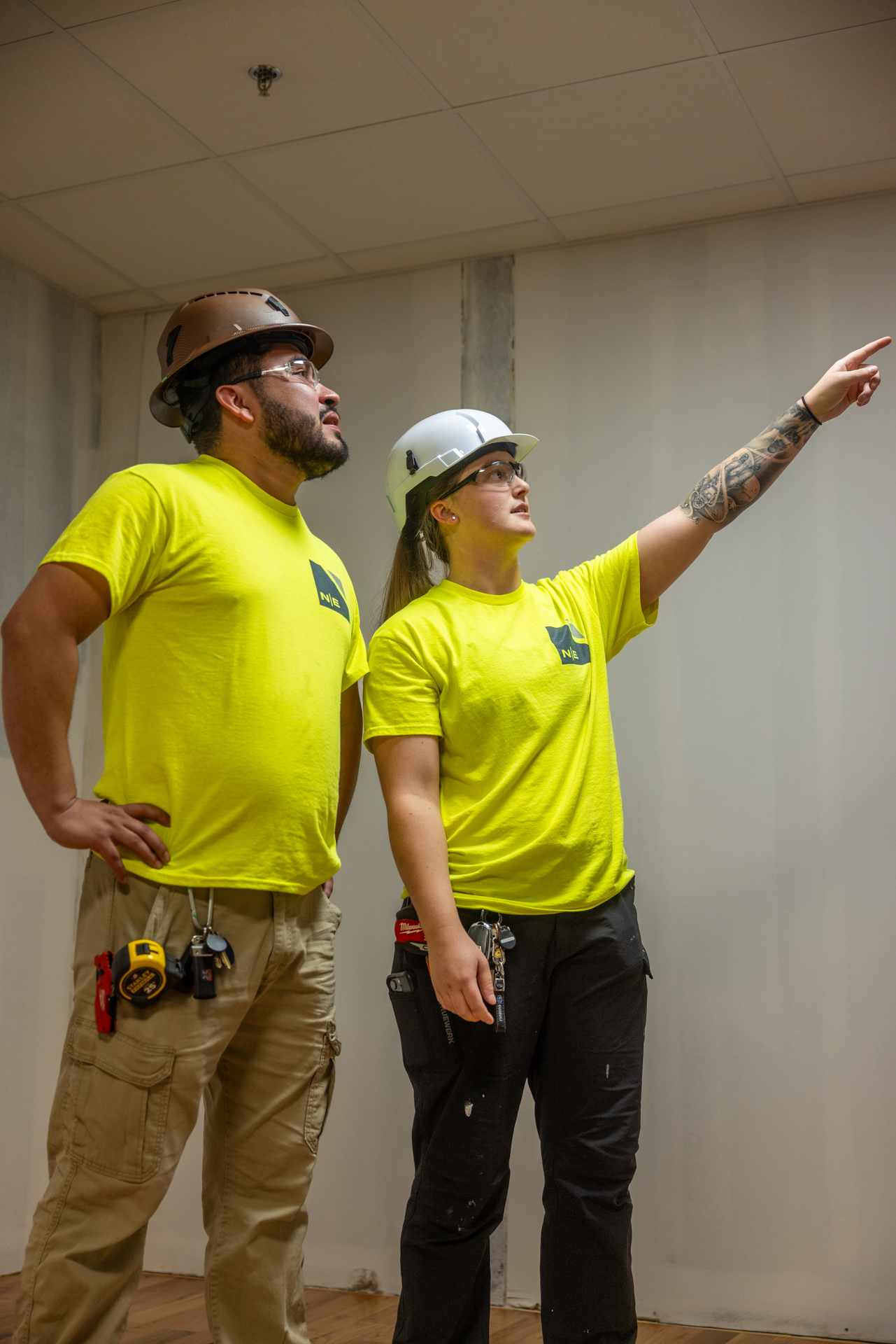 North East Building Group crew members reviewing work on site