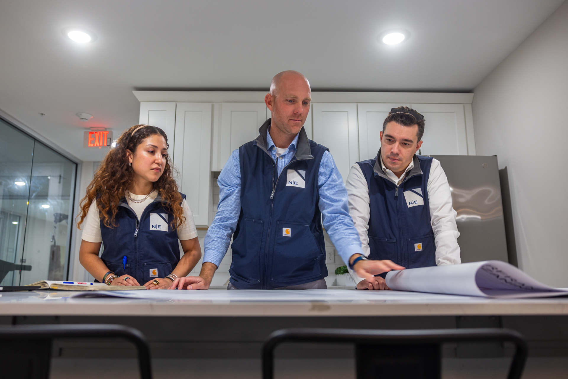 North East Building Group team reviewing project plans