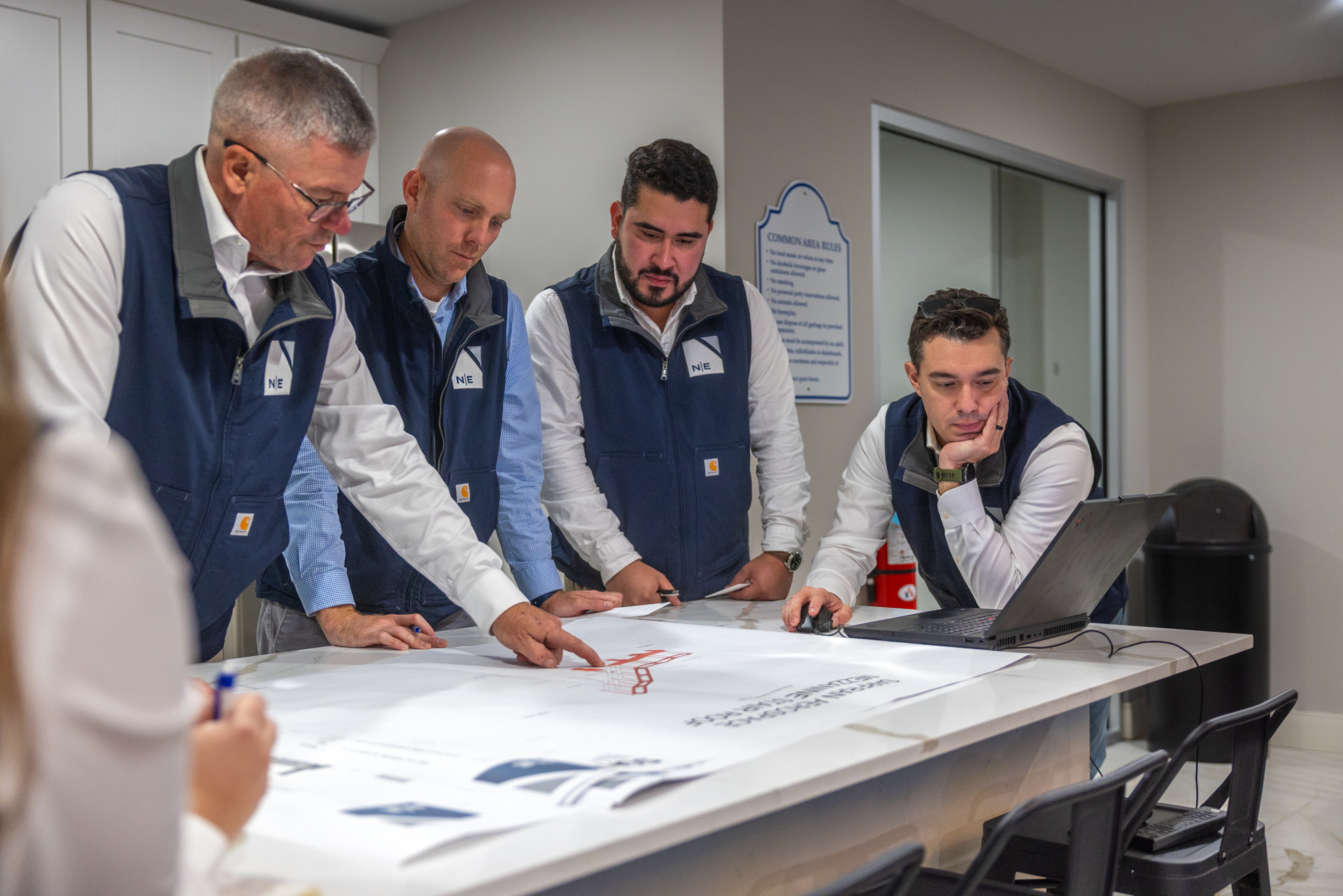 North East Building Group team working through drawings together